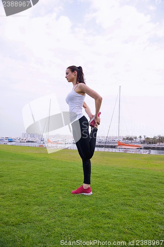 Image of Young beautiful  woman jogging  on morning