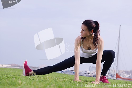 Image of Young beautiful  woman jogging  on morning