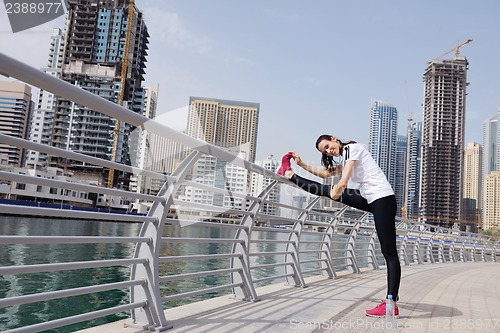 Image of Young beautiful  woman jogging  on morning