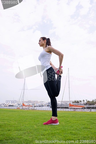 Image of Young beautiful  woman jogging  on morning