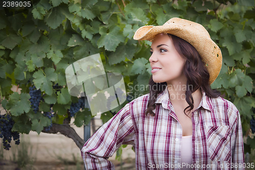 Image of Young Adult Female Portrait Wearing Cowboy Hat in Vineyard