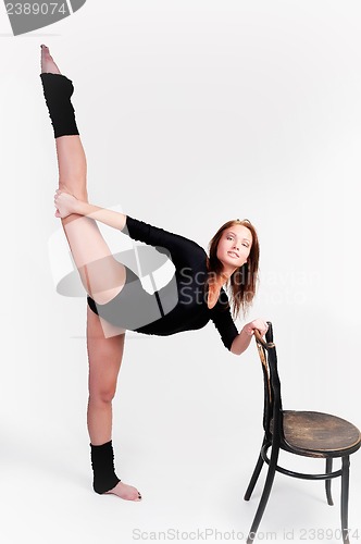 Image of fitness woman making balance exercise