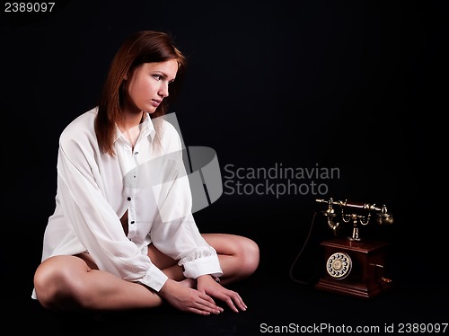 Image of sexy young woman waiting call