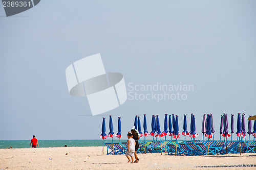 Image of Beach chair and colorful umbrella on the beach. Thailand