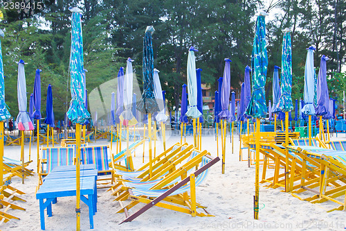 Image of Beach chair and colorful umbrella on the beach. Thailand