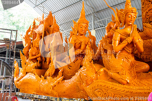 Image of UBONRATCHATHANI, THAILAND - JULY 23: Candles are carved out of w