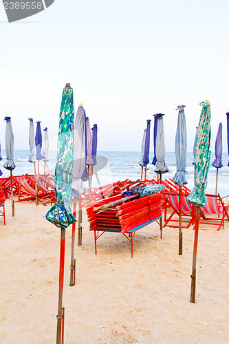 Image of Beach chair and colorful umbrella on the beach. Thailand