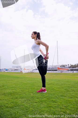 Image of Young beautiful  woman jogging  on morning