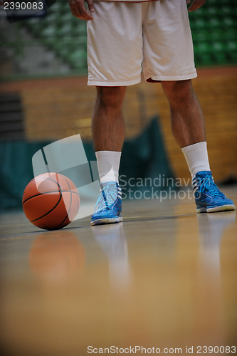 Image of basketball ball and net on black background