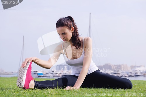 Image of Young beautiful  woman jogging  on morning