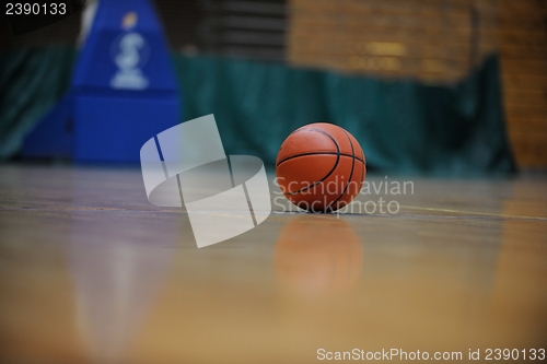 Image of basketball ball and net on black background