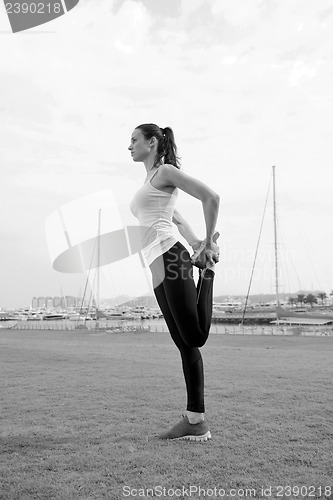 Image of Young beautiful  woman jogging  on morning