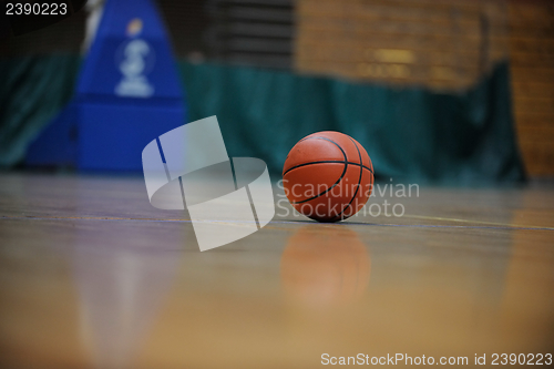 Image of basketball ball and net on black background
