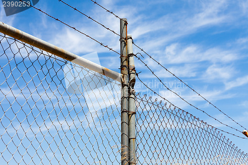 Image of Mesh fence with barbed wire