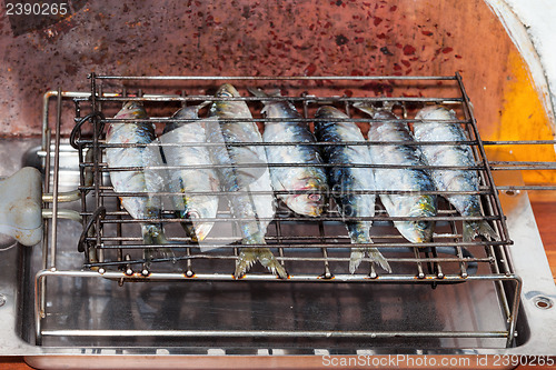 Image of Fresh sardines on the grill