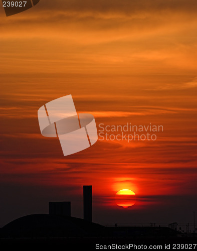 Image of beautiful sunrise with factory in the foreground