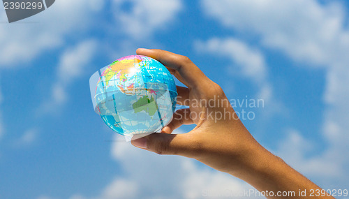 Image of Holding a globe