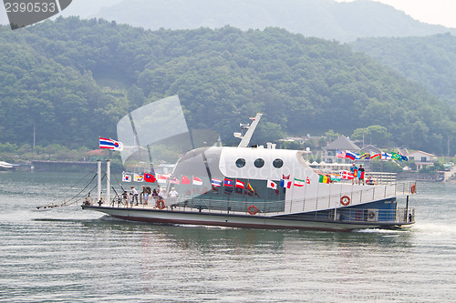 Image of NAMISEOM - JUNE 15: Visitors arrive in Nami Island by ferry on J