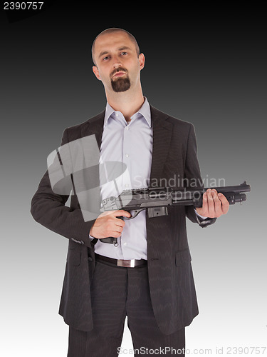 Image of Mafia man is holding a shotgun