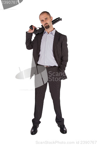 Image of Mafia man is holding a shotgun