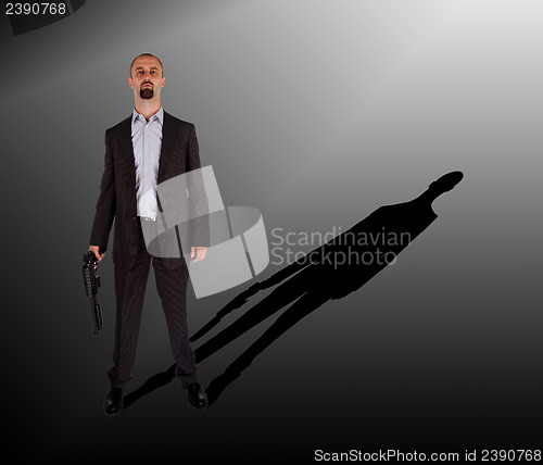 Image of Mafia man is holding a shotgun