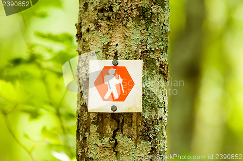 Image of orange hiking trail sign