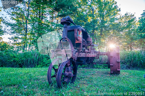 Image of old rusty agriculture farm tractor