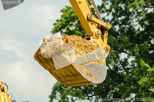 Image of backhoe scoop of dirt