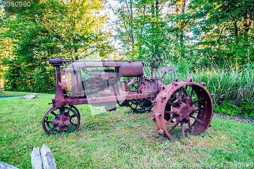 Image of old rusty agriculture farm tractor