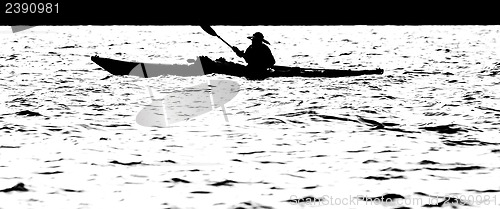 Image of Sillouette of man kayaking on lake