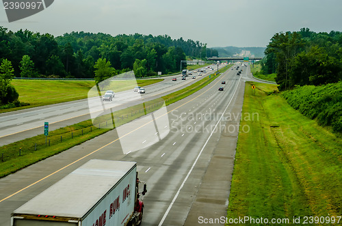 Image of highway traffic near a big city