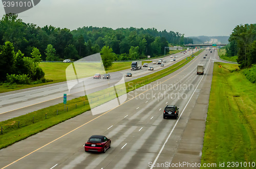 Image of highway traffic near a big city
