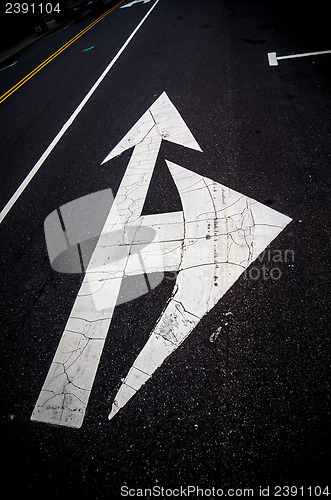 Image of painted direction arrow on pavement