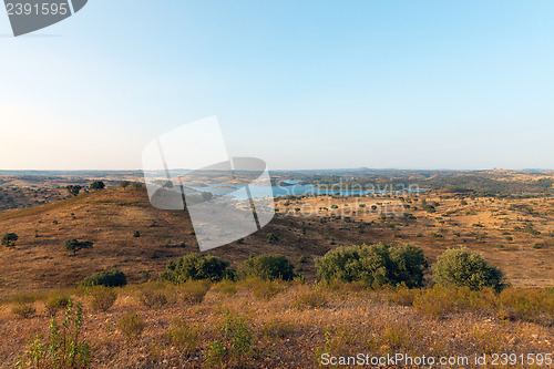 Image of Rural landscape with grassland and a lake