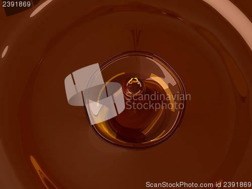 Image of Alcoholic beverage splash with droplet: brandy or cognac