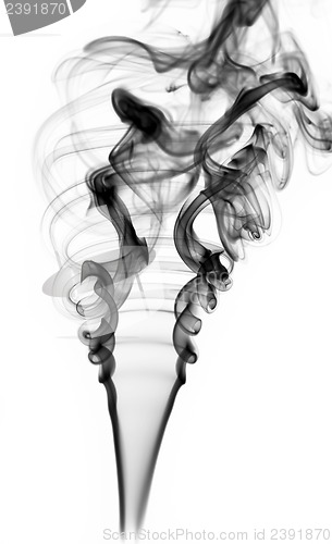 Image of Abstract black smoke swirls on white