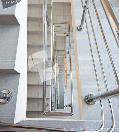 Image of staircase with metal railing