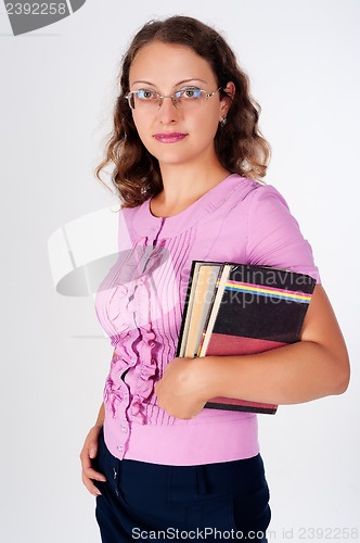 Image of young caucasian woman with books