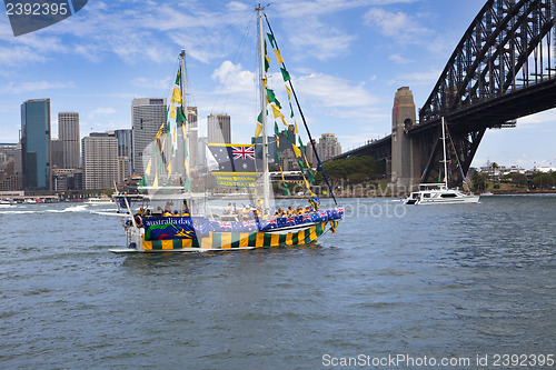 Image of Decorated yacht sails under Sydney Harbour Bridge on Australia D