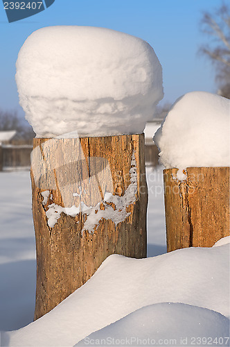 Image of Tree Stump covered in snow.