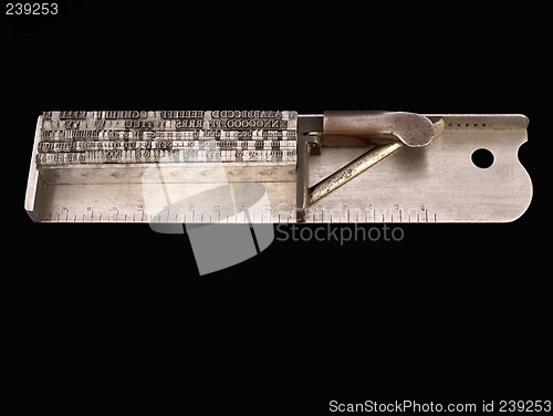 Image of typesetter composing stick