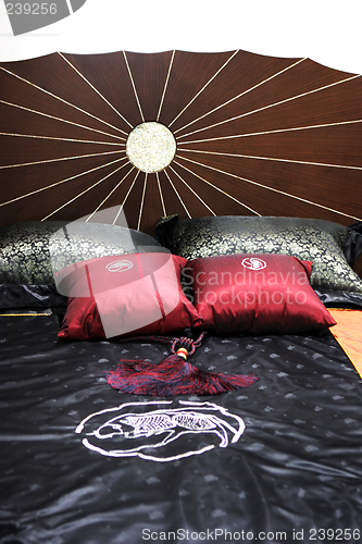 Image of Bed with satin sheets