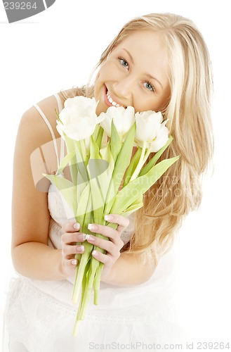 Image of happy blond with white tulips #2