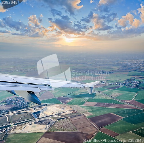 Image of aerial view through airplane porthole 
