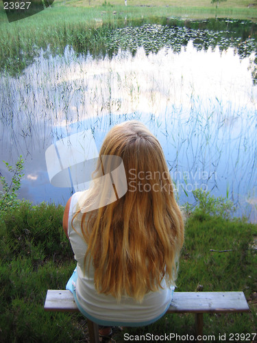 Image of Young girl by lake