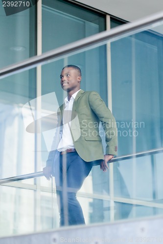 Image of young successful african business man outdoor in summer