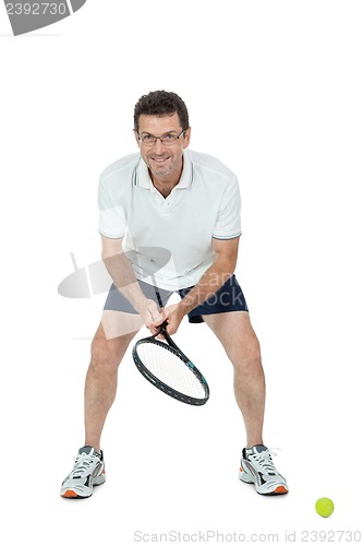Image of smiling adult tennis player with racket isolated