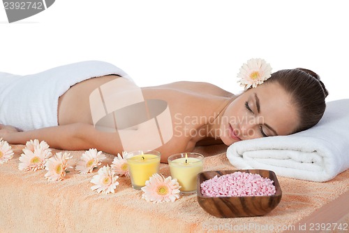 Image of young attractive smilig woman doing wellness spa