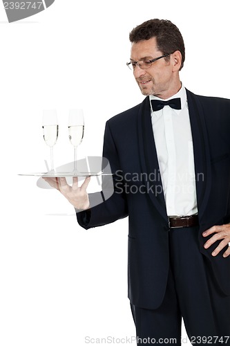 Image of adult male waiter serving two glass of champagne isolated