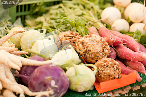 Image of fresh root vegetable carrot potatoes onion beet on market 